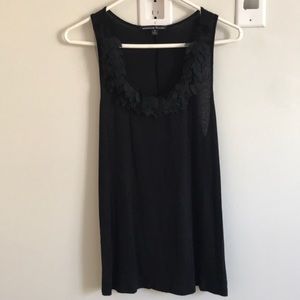 Black tank with feathering detail around neck